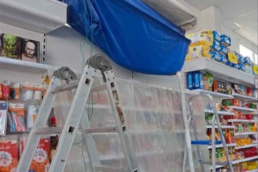 Preventiva em loja de conveniência, com o equipamento protegido por lona